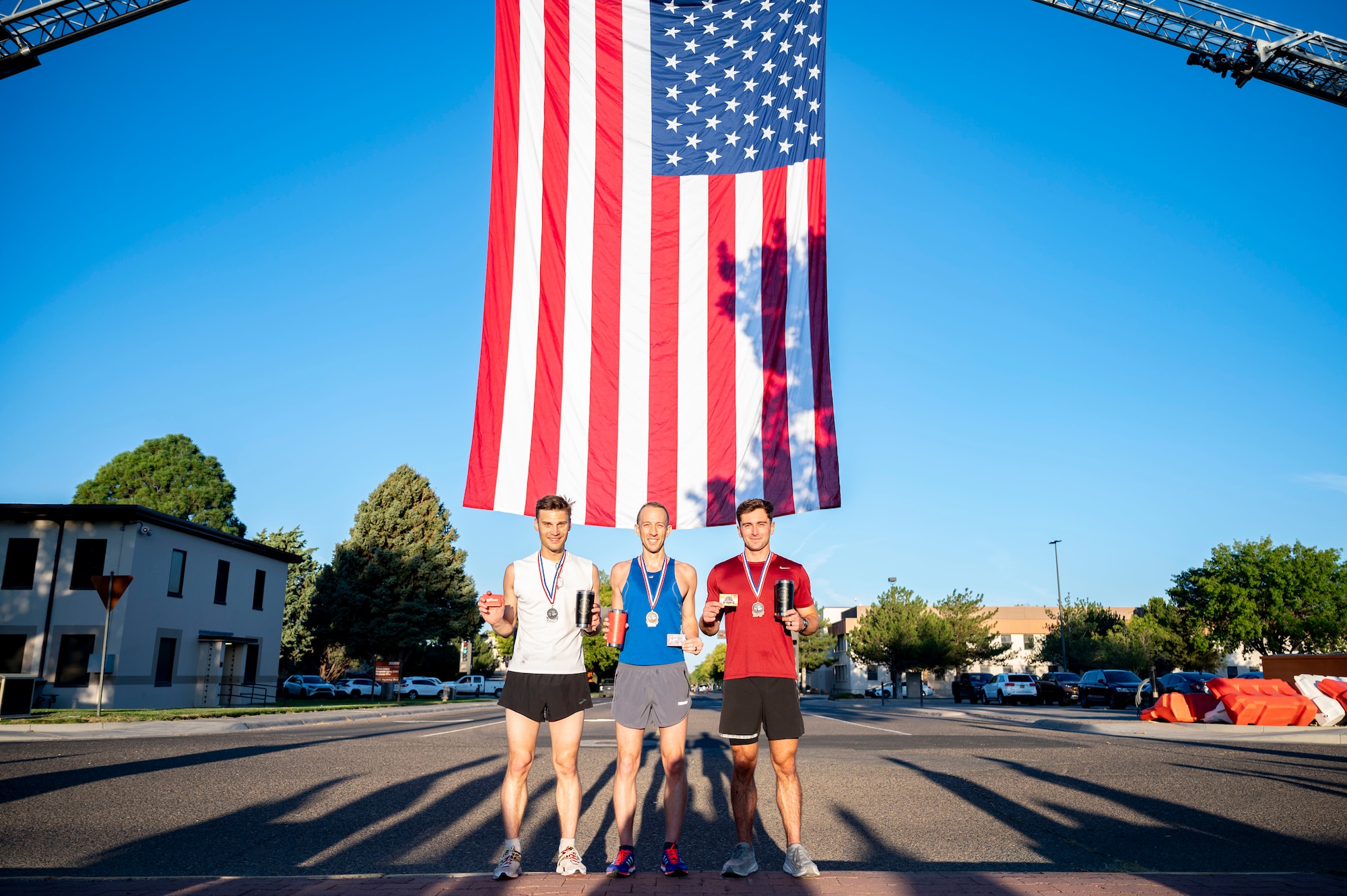People pose for a photo with their trophies.