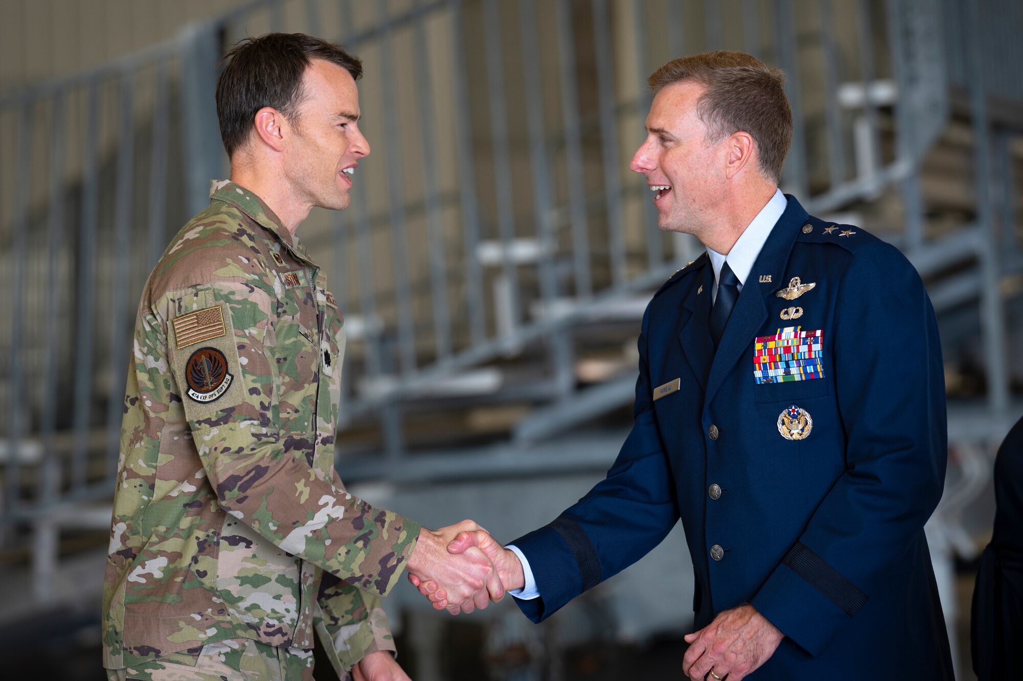 Maj. Gen. David Mineau, right, newly appointed Air Forces Southern commander, greets Lt. Col. David Estrem, Foreign Area Officer, after a Change of Command ceremony at Davis-Monthan Air Force Base, Arizona, Sep. 11, 2024. Mineau assumed command after Maj. Gen. Evan Pettus, who will become the military deputy commander for U.S. Southern Command. (U.S. Air Force photo by Tech. Sgt. Rachel Maxwell)