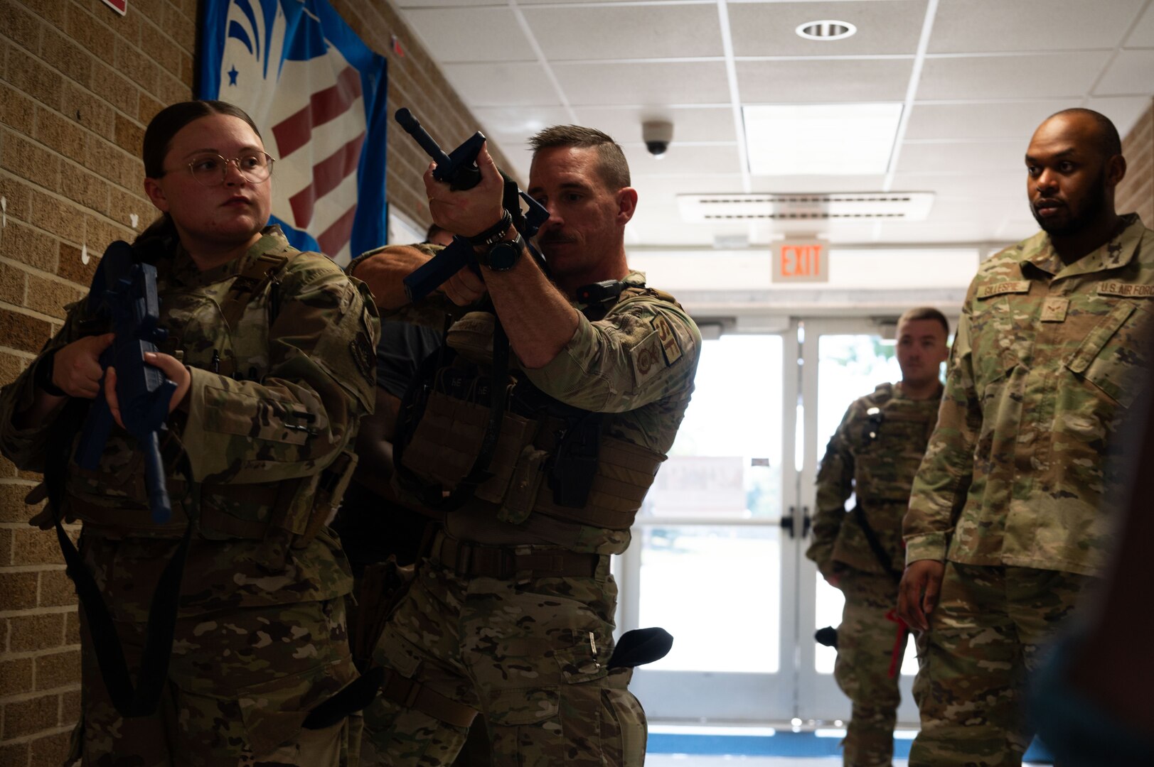 Tech. Sgt. Justin McMahon, 436th Security Forces Squadron flight chief, demonstrates a gun position during school shooter response training at Dover, Delaware, Sept. 10, 2024. The training was used to aid the 436th SFS in reaffirming readiness in response to an active school shooter. (U.S. Air Force Photo by Senior Airman Dieondiere Jefferies)