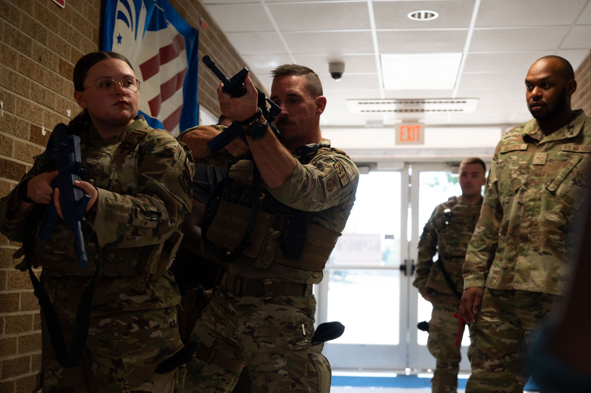 Tech. Sgt. Justin McMahon, 436th Security Forces Squadron flight chief, demonstrates a gun position during school shooter response training at Dover, Delaware, Sept. 10, 2024. The training was used to aid the 436th SFS in reaffirming readiness in response to an active school shooter. (U.S. Air Force Photo by Senior Airman Dieondiere Jefferies)