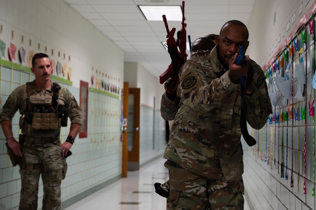 Airmen from the 436th Security Forces Squadron learn a basic stacking technique during school shooter response training at Dover, Delaware, Sept. 10, 2024. The training was used to aid the 436th SFS in reaffirming readiness in response to an active school shooter. (U.S. Air Force Photo by Senior Airman Dieondiere Jefferies)