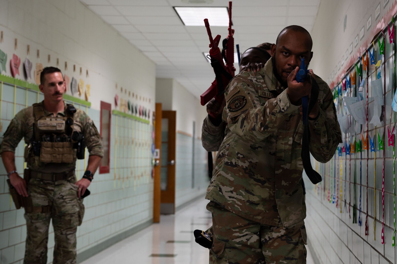 Airmen from the 436th Security Forces Squadron learn a basic stacking technique during school shooter response training at Dover, Delaware, Sept. 10, 2024. The training was used to aid the 436th SFS in reaffirming readiness in response to an active school shooter. (U.S. Air Force Photo by Senior Airman Dieondiere Jefferies)