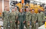 Vice Adm. Nancy Lacore, Chief of Navy Reserve and commander of Navy Reserve Force, center, and Navy Reserve Force Master Chief Tracy L. Hunt, far right, take a group photo with active-duty and reserve Sailors who support Undersea Rescue Command (URC) at Naval Air Station North Island. (MC1 Aaron T. Smith)