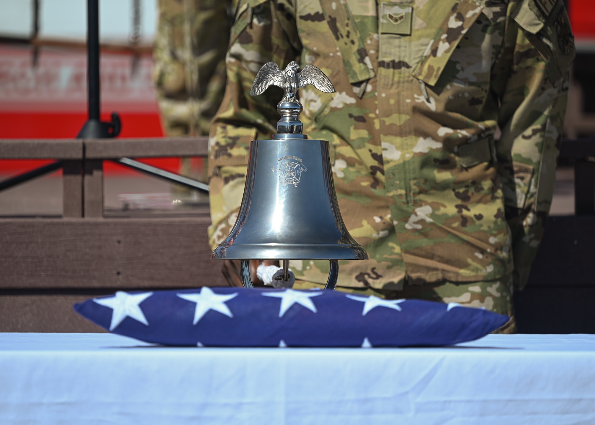 A man in uniform rings the firefighters bell.