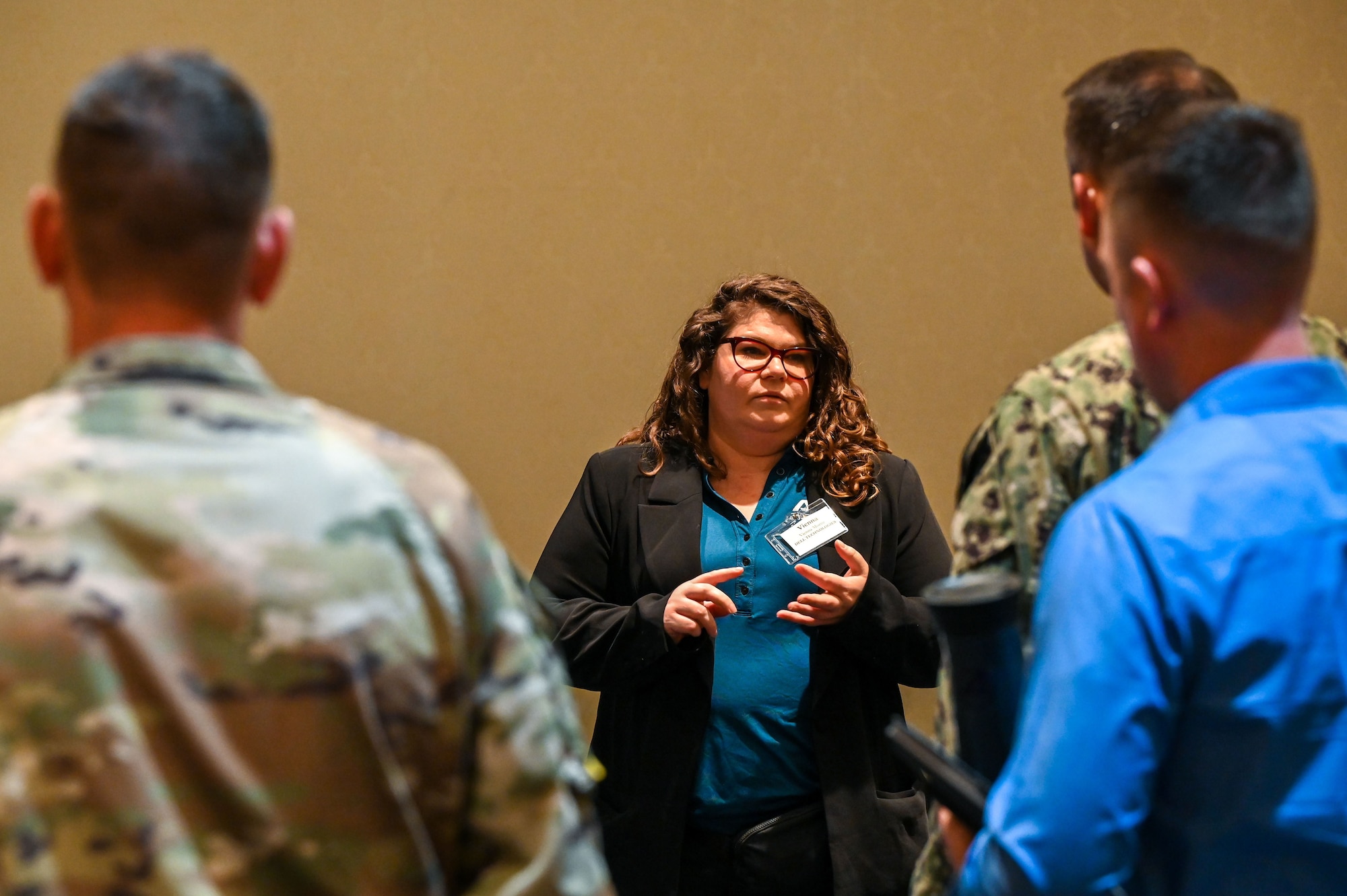 U.S. service members listen to briefers during the Tech Expo.