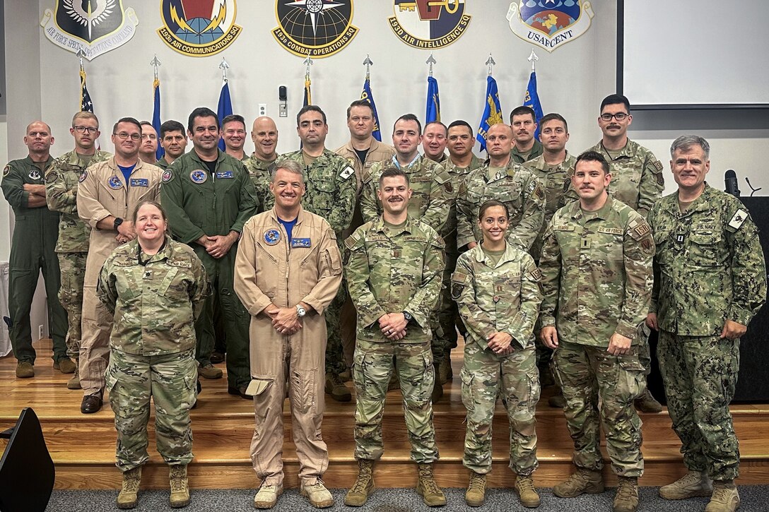 Service members from the U.S. 5th Fleet Naval and Amphibious Liaison Element Headquarters and the 193rd Air Operations Group pose for a group photo in State College, Pennsylvania. The service members participated in a joint training exercise Aug. 1-4, 2024, marking a key component of the Navy Reserve's efforts to enhance high-end combat capabilities and operational readiness. (courtesy photo)