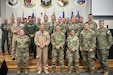 Service members from the U.S. 5th Fleet Naval and Amphibious Liaison Element Headquarters and the 193rd Air Operations Group pose for a group photo in State College, Pennsylvania. The service members participated in a joint training exercise Aug. 1-4, 2024, marking a key component of the Navy Reserve's efforts to enhance high-end combat capabilities and operational readiness. (courtesy photo)