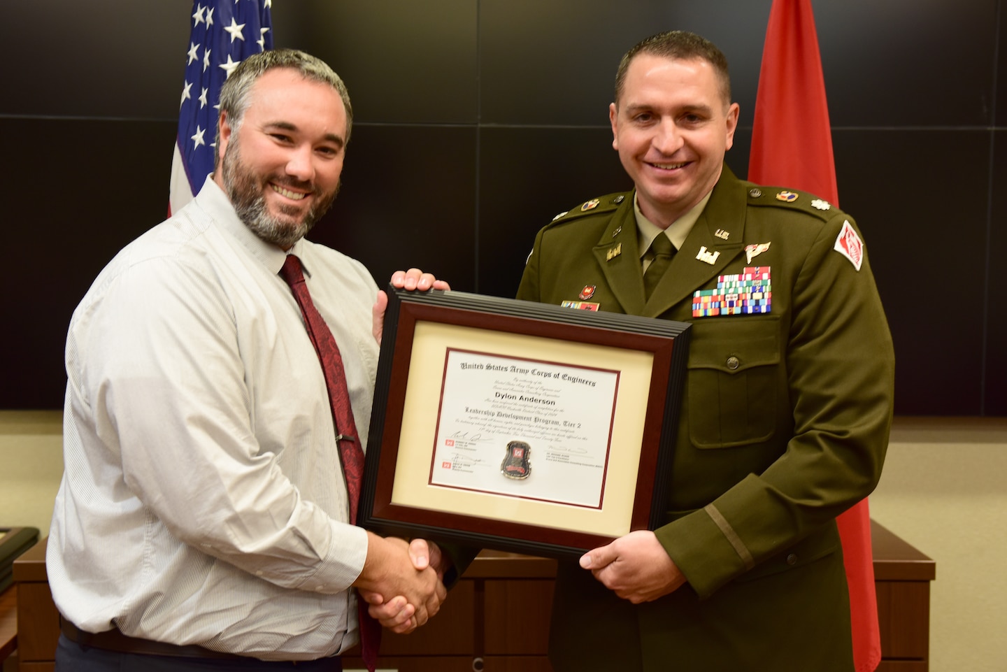 Dylon Anderson, U.S. Army Corps of Engineers Nashville District, receives a certificate of completion for the 2024 Leadership Development Program Level II Course from Lt. Col. Robert W. Green, Nashville District commander, during a graduation ceremony Sept. 11, 2024, at the district headquarters in Nashville, Tennessee. (USACE Photo by Lee Roberts)