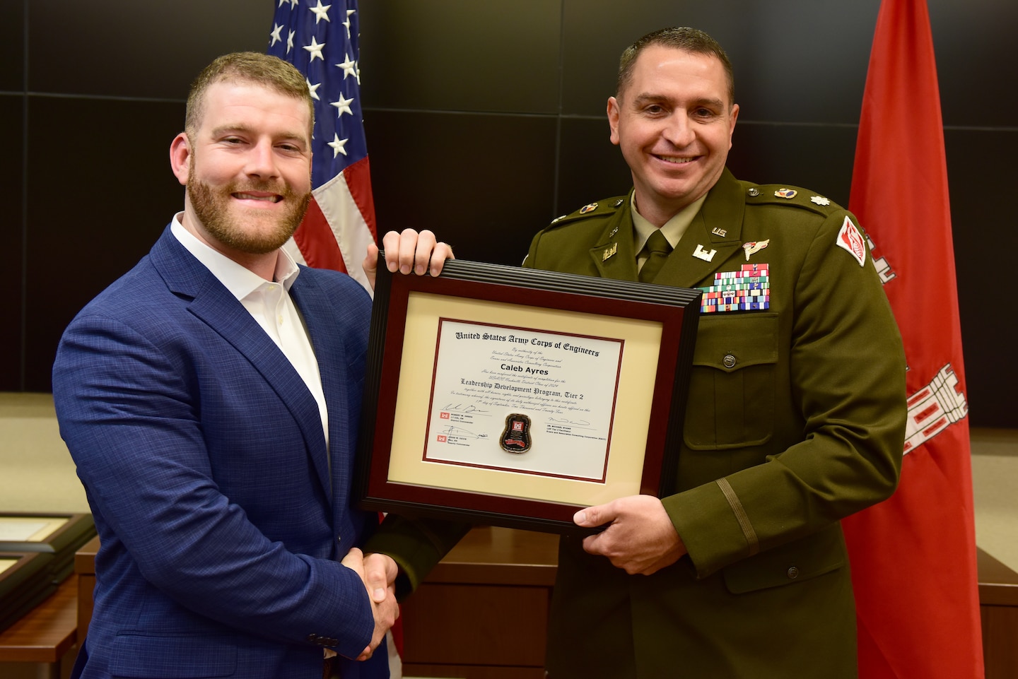 Caleb Ayres, U.S. Army Corps of Engineers Nashville District, receives a certificate of completion for the 2024 Leadership Development Program Level II Course from Lt. Col. Robert W. Green, Nashville District commander, during a graduation ceremony Sept. 11, 2024, at the district headquarters in Nashville, Tennessee. (USACE Photo by Lee Roberts)