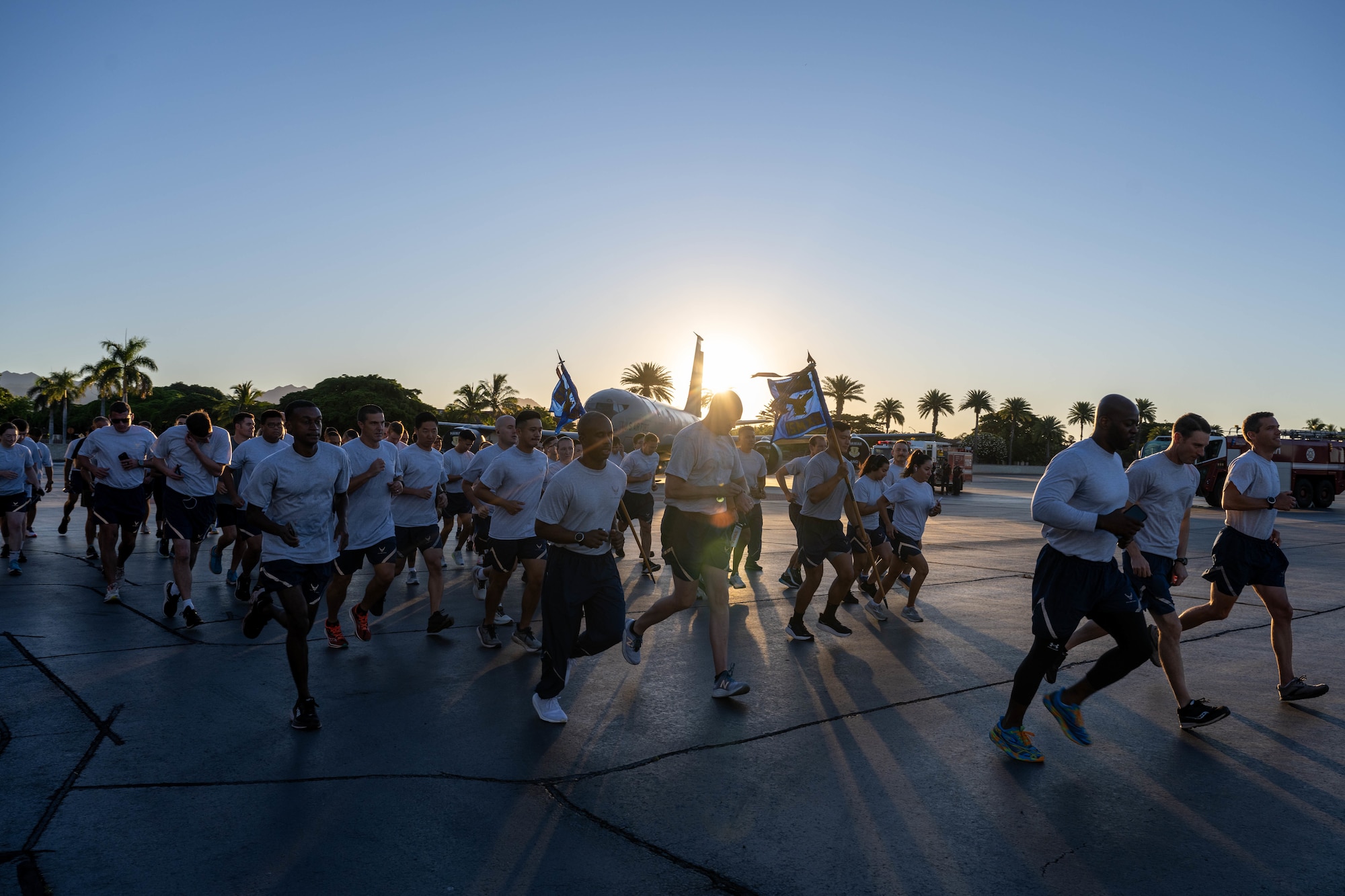 Airmen run on the flightline.