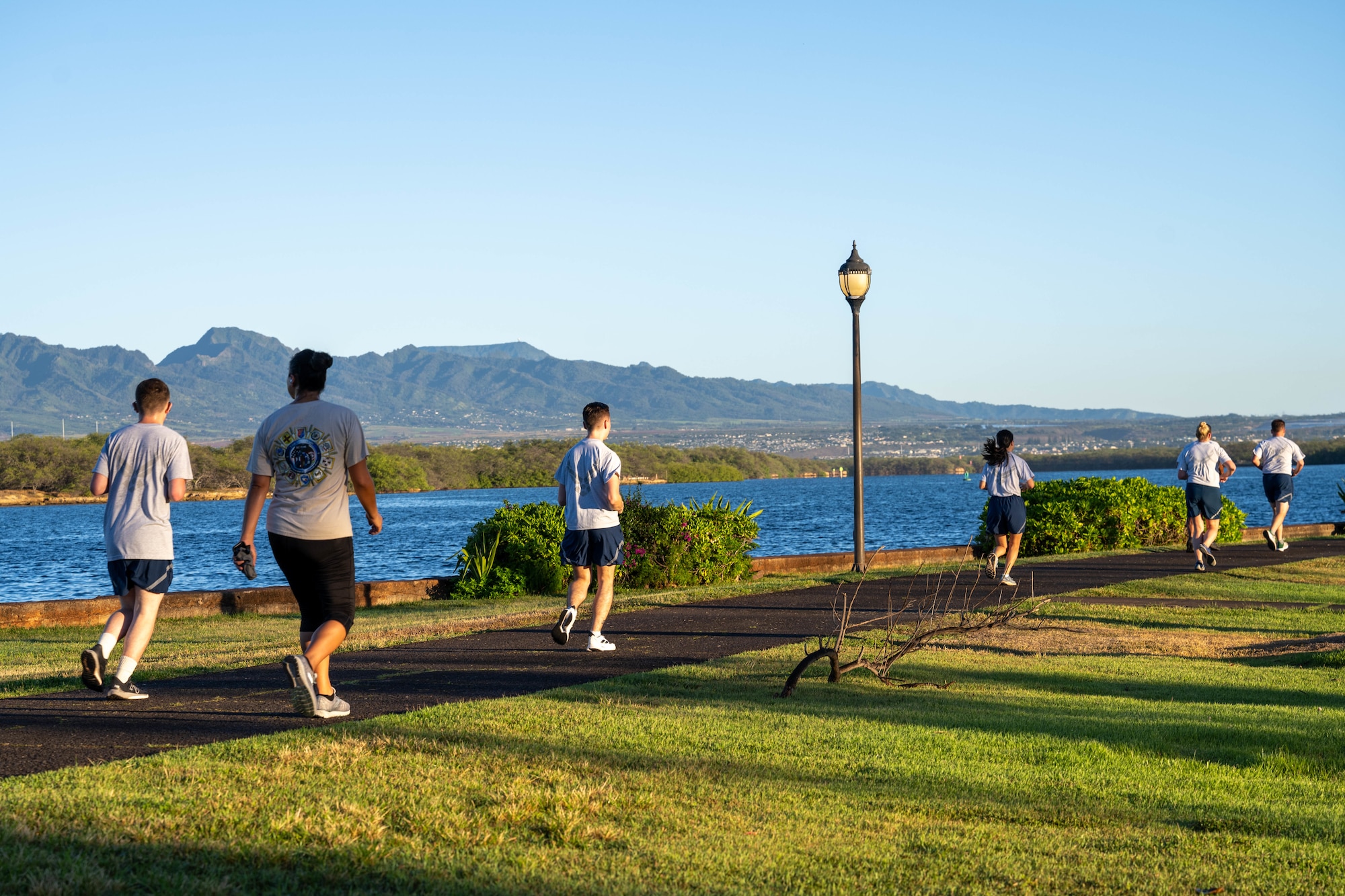 Airmen run on a trail.