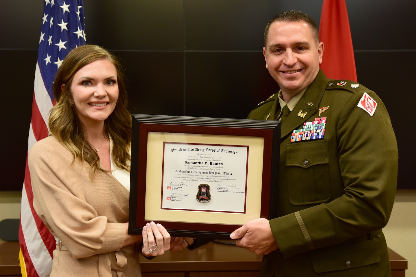 Samantha "Dani" Bautch, U.S. Army Corps of Engineers Nashville District, receives a certificate of completion for the 2024 Leadership Development Program Level II Course from Lt. Col. Robert W. Green, Nashville District commander, during a graduation ceremony Sept. 11, 2024, at the district headquarters in Nashville, Tennessee. (USACE Photo by Lee Roberts)