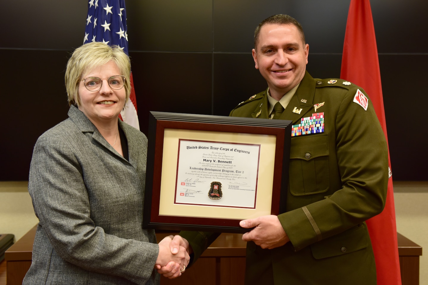 Mary "Ginger" Bennett, U.S. Army Corps of Engineers Nashville District, receives a certificate of completion for the 2024 Leadership Development Program Level II Course from Lt. Col. Robert W. Green, Nashville District commander, during a graduation ceremony Sept. 11, 2024, at the district headquarters in Nashville, Tennessee. (USACE Photo by Lee Roberts)