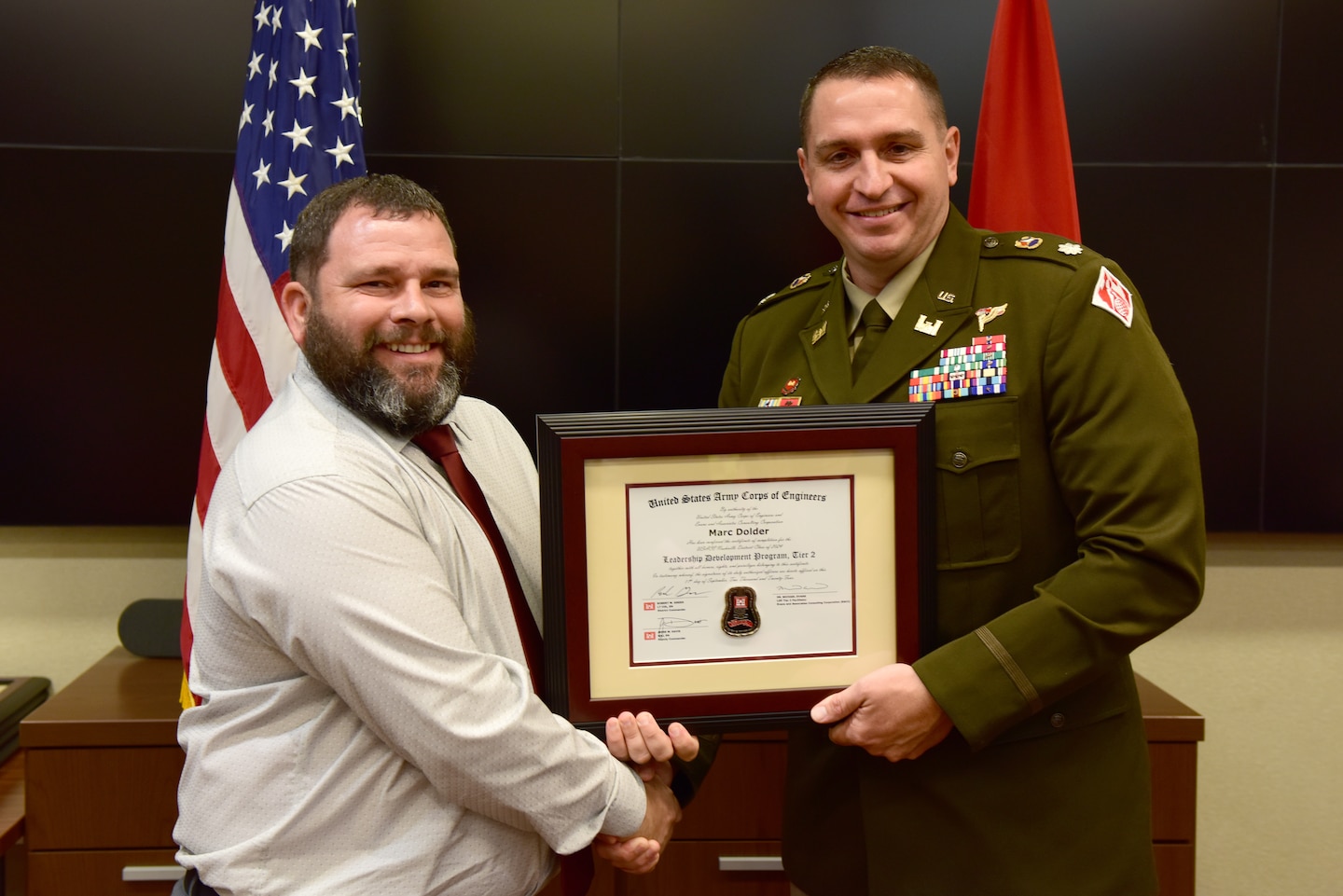 Marc Dolder, U.S. Army Corps of Engineers Nashville District, receives a certificate of completion for the 2024 Leadership Development Program Level II Course from Lt. Col. Robert W. Green, Nashville District commander, during a graduation ceremony Sept. 11, 2024, at the district headquarters in Nashville, Tennessee. (USACE Photo by Lee Roberts)