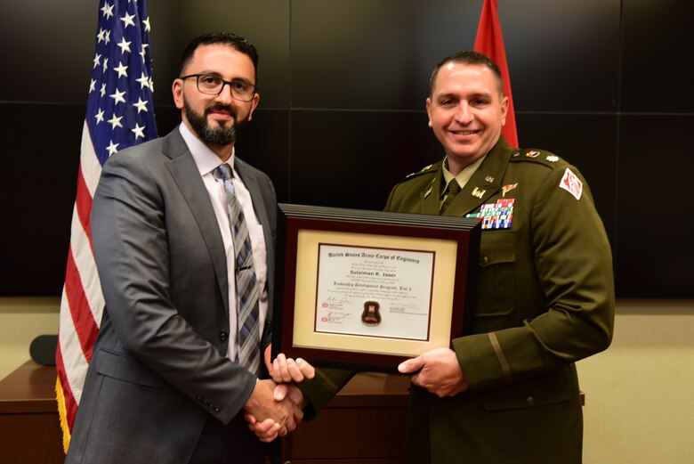Sulaiman "Sam" Jaser, U.S. Army Corps of Engineers Nashville District, receives a certificate of completion for the 2024 Leadership Development Program Level II Course from Lt. Col. Robert W. Green, Nashville District commander, during a graduation ceremony Sept. 11, 2024, at the district headquarters in Nashville, Tennessee. (USACE Photo by Lee Roberts)
