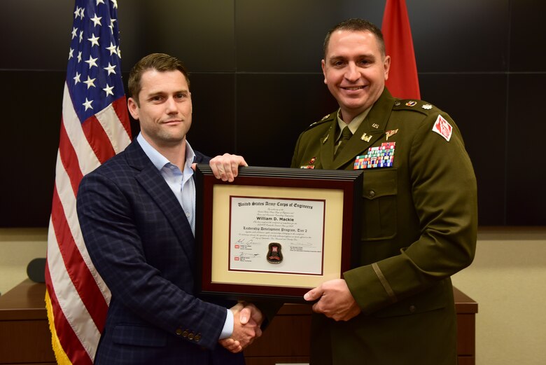 William D. Mackie, U.S. Army Corps of Engineers Nashville District, receives a certificate of completion for the 2024 Leadership Development Program Level II Course from Lt. Col. Robert W. Green, Nashville District commander, during a graduation ceremony Sept. 11, 2024, at the district headquarters in Nashville, Tennessee. (USACE Photo by Lee Roberts)