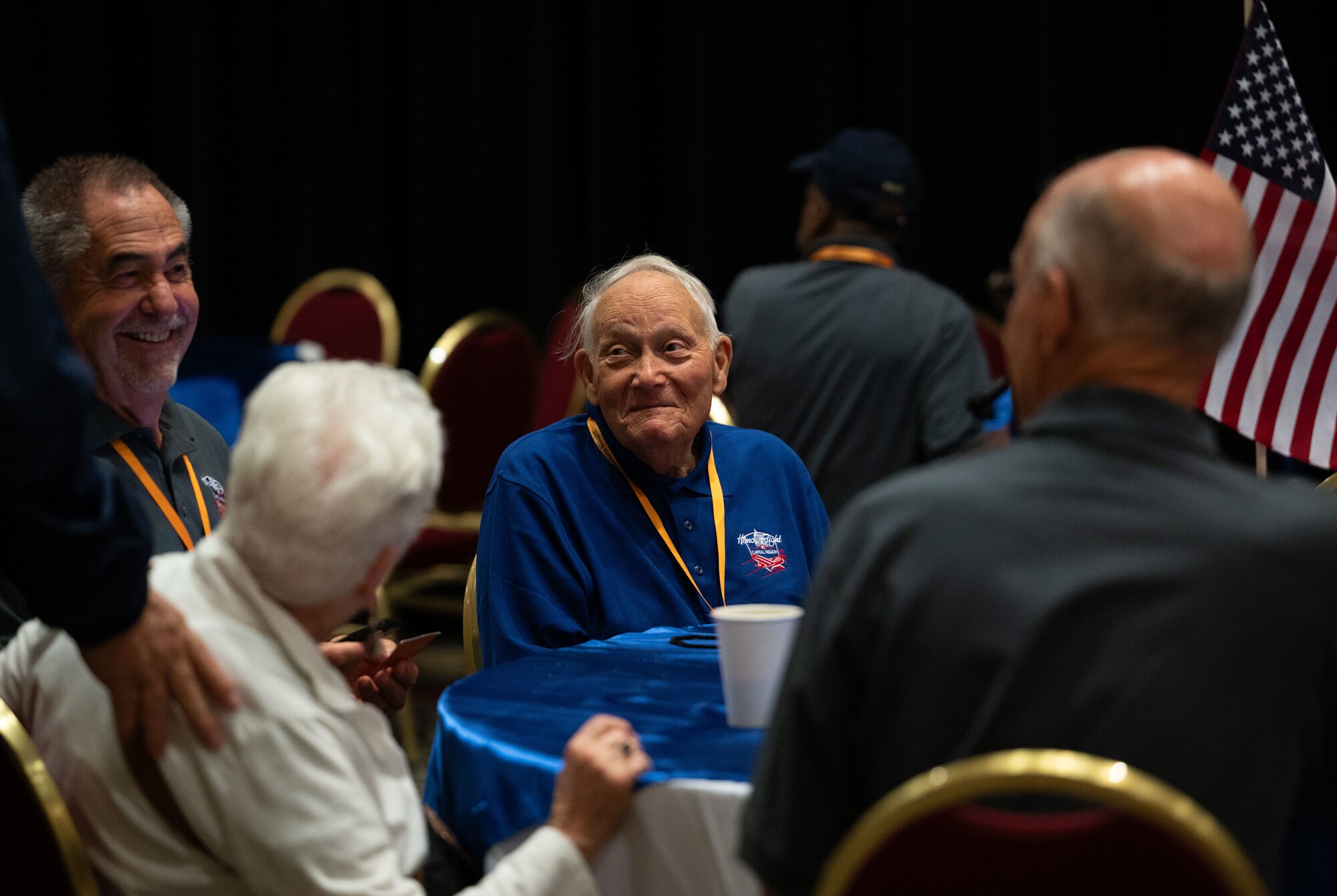Paul George, U.S. Army veteran, sits with his guardian at the send-off for the Capital Region Honor Flight at Bally’s Dover Casino Resort, Dover, Delaware, Sept. 12, 2024. The Honor Flight is a program for U.S. veterans to visit monuments in Washington D.C. for a day, honoring them and giving proper recognition to their service. (U.S. Air Force photo by Airman Liberty Matthews)
