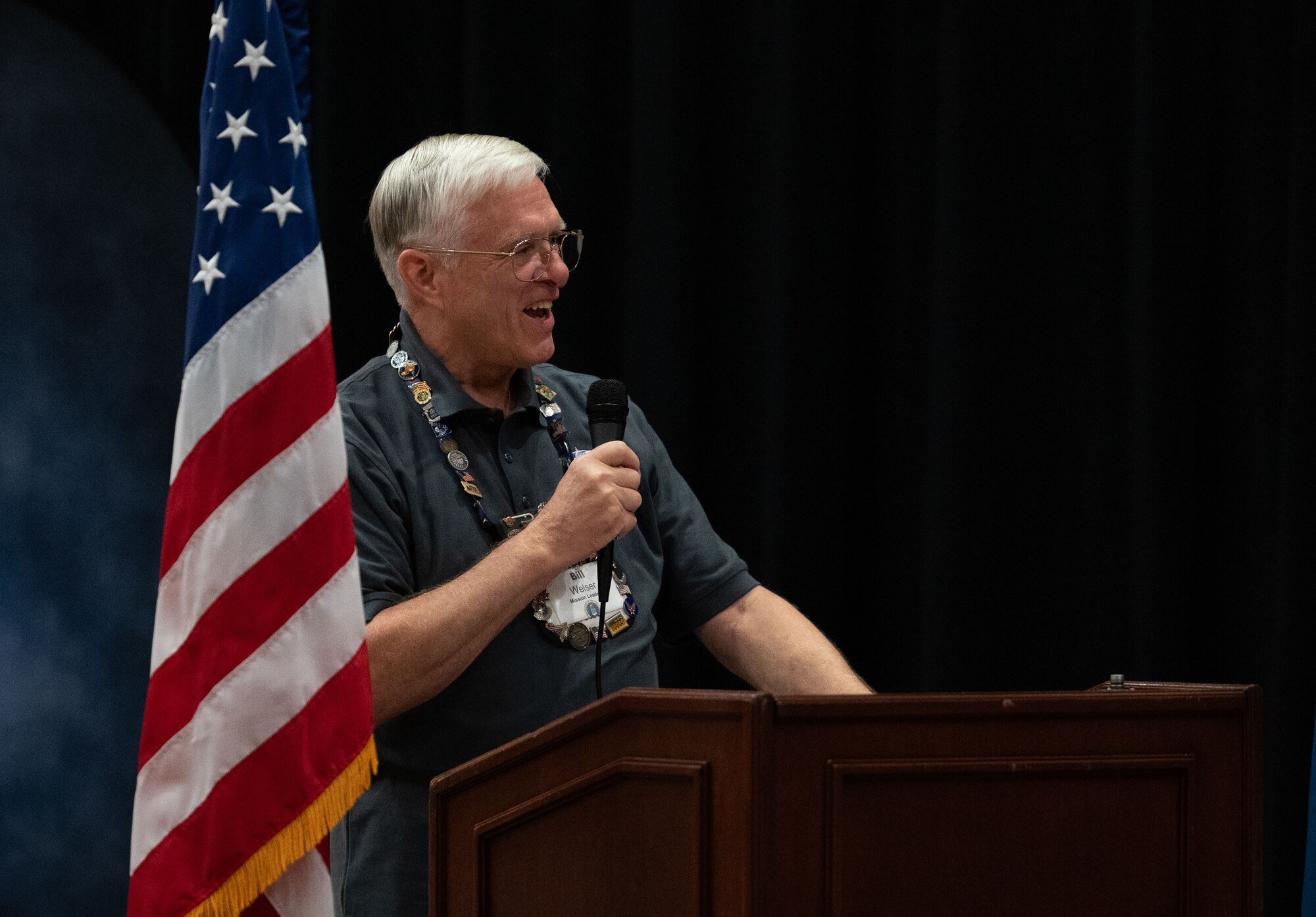 Retired U.S. Air Force Lt. Gen. William Welser III, gives opening remarks at the send-off for the Capital Region Honor Flight at Bally’s Dover Casino Resort, Dover, Delaware, Sept. 12, 2024. The Honor Flight is a program for U.S. veterans to visit monuments in Washington D.C. for a day, honoring them and giving proper recognition to their service. (U.S. Air Force photo by Airman Liberty Matthews)