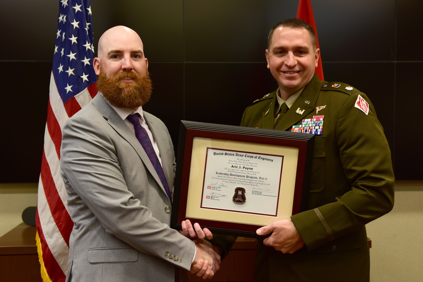 Aric Payne, U.S. Army Corps of Engineers Nashville District, receives a certificate of completion for the 2024 Leadership Development Program Level II Course from Lt. Col. Robert W. Green, Nashville District commander, during a graduation ceremony Sept. 11, 2024, at the district headquarters in Nashville, Tennessee. (USACE Photo by Lee Roberts)