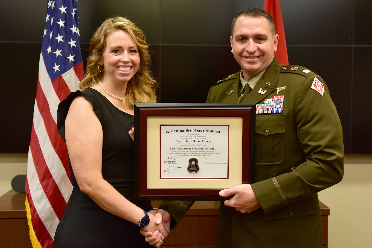 Sarah Peace, U.S. Army Corps of Engineers Nashville District, receives a certificate of completion for the 2024 Leadership Development Program Level II Course from Lt. Col. Robert W. Green, Nashville District commander, during a graduation ceremony Sept. 11, 2024, at the district headquarters in Nashville, Tennessee. (USACE Photo by Lee Roberts)