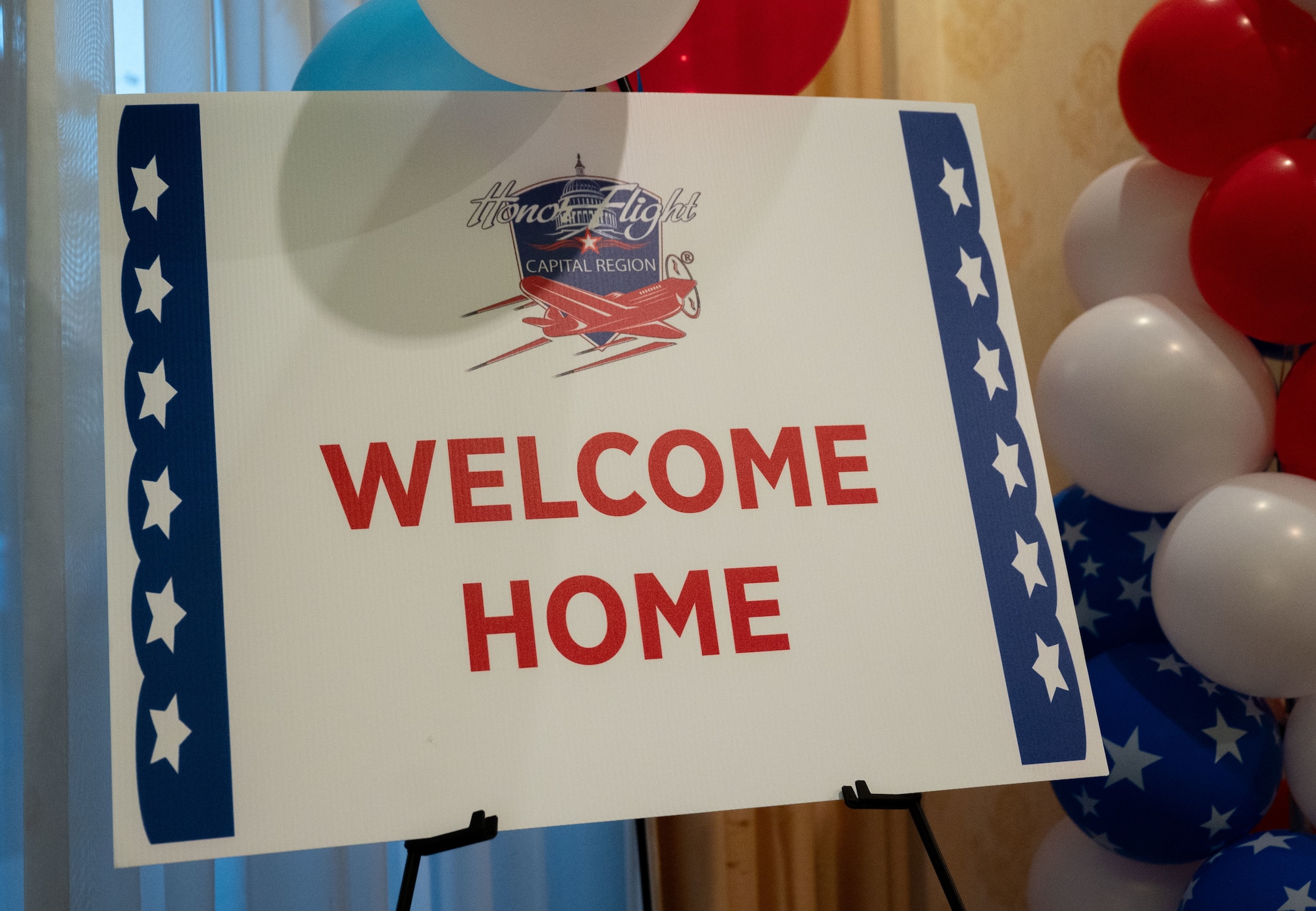 A welcome home sign is displayed for the Capital Region Honor Flight return at Bally’s Dover Casino Resort, Dover, Delaware, Sept. 12, 2024. The Honor Flight is a program for U.S. veterans to visit monuments in Washington D.C. for a day, honoring them and giving proper recognition to their service. (U.S. Air Force photo by Airman Liberty Matthews)