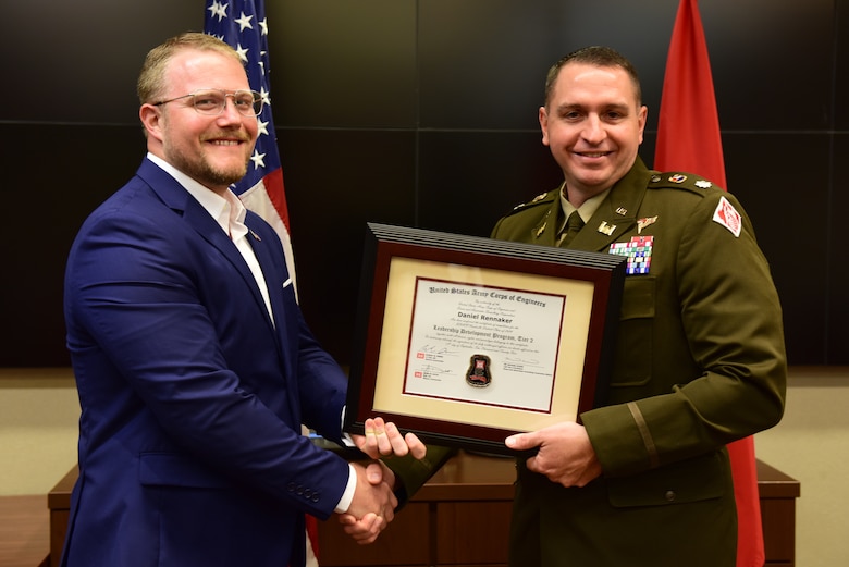 Daniel Rennaker, U.S. Army Corps of Engineers Nashville District, receives a certificate of completion for the 2024 Leadership Development Program Level II Course from Lt. Col. Robert W. Green, Nashville District commander, during a graduation ceremony Sept. 11, 2024, at the district headquarters in Nashville, Tennessee. (USACE Photo by Lee Roberts)