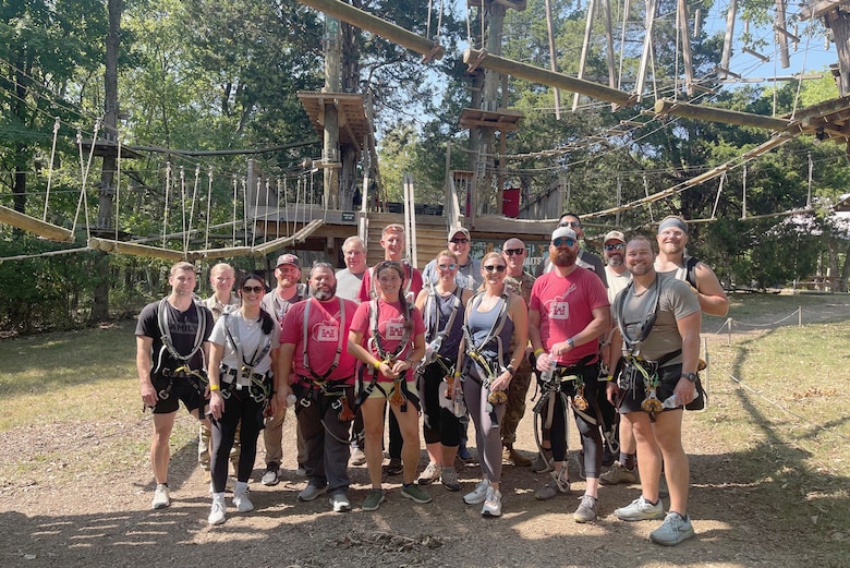Participants of the U.S. Army Corps of Engineers Nashville District 2024 Leadership Development Program Level II Course pose together Sept. 10, 2024, with Maj. Jesse Davis, Nashville District deputy commander; and Michael Evans, course instructor, during a team building and confidence exercise at The Adventure Park in Nashville, Tennessee. They ziplined more than 50 feet high in the air and overcame challenging obstacles during the class activity. (USACE Photo by Kelley Peck)