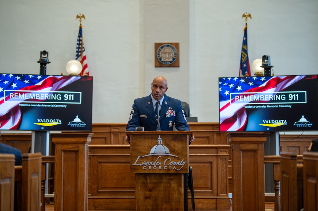 U.S. Air Force Chief Master Sgt. Dion Bullock, 23rd Civil Engineer Squadron fire chief, speaks during 9/11 ceremony at Lowndes County Courthouse, Valdosta, Georgia, Sept. 11, 2024. Bullock recounted his experience of this tragic event and the aftermath for the United States. (U.S. Air Force photo by Airman 1st Class Iain Stanley)