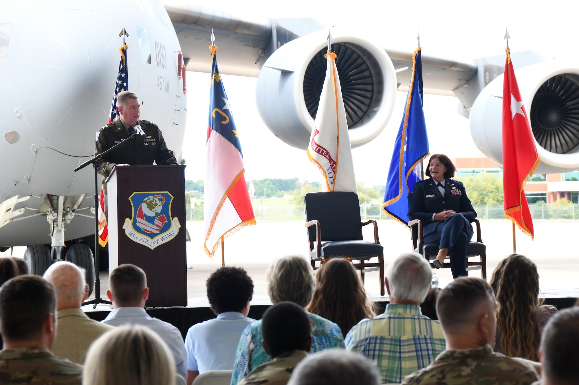 U.S. Army Maj. Gen. Todd Hunt, the Adjutant General of the North Carolina National Guard, officiates the promotion of the Chief of Staff for the North Carolina Air National Guard (NCANG), U.S. Air Force Brig. Gen. Shawne M. Johnson during a ceremony held inside a C-17 Globemaster hangar at the Charlotte, Douglass International Airport base, Sept. 8, 2024.
