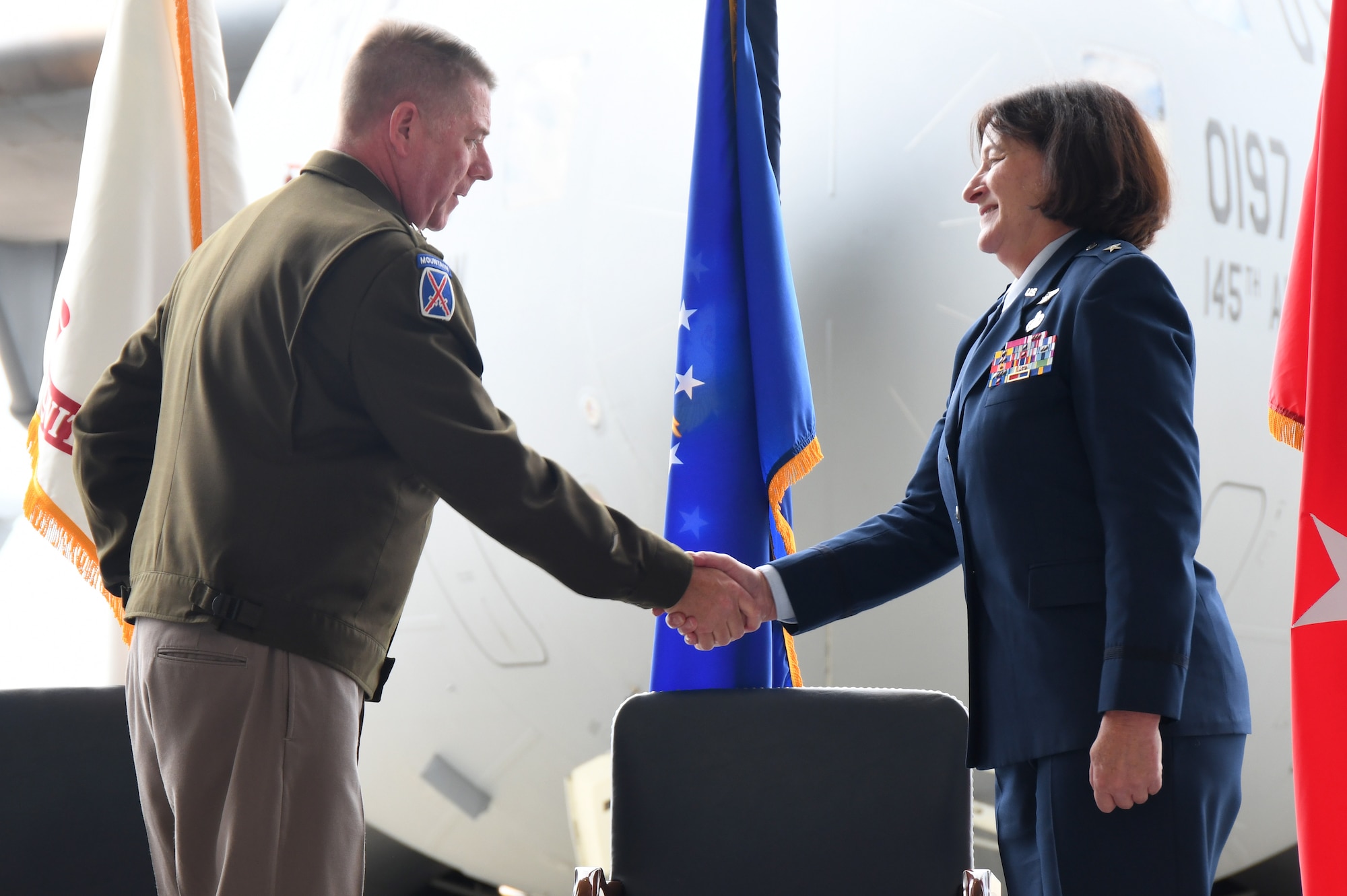 U.S. Army Maj. Gen. Todd Hunt, the Adjutant General of the North Carolina National Guard, congratulates U.S. Air Force Brig. Gen. Shawne M. Johnson, Chief of Staff for the North Carolina Air National Guard (NCANG) during her promotion ceremony held inside a C-17 Globemaster III hangar held at the Charlotte-Douglas International Airport base, Sept. 8, 2024.