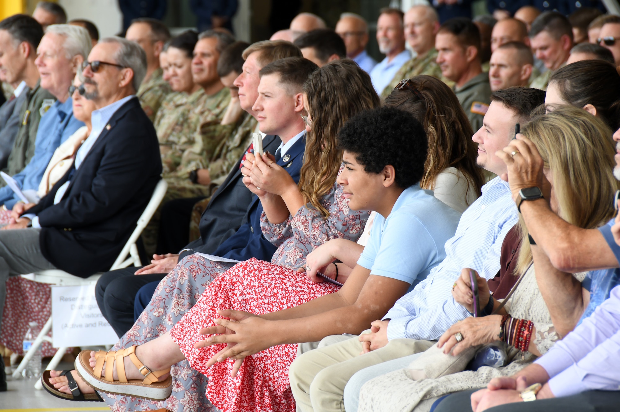 Family and friends listen as Chief of Staff for the North Carolina Air National Guard (NCANG), U.S. Air Force Brig. Gen. Shawne M. Johnson thanks them for their attendance during her promotion ceremony held inside a C-17 Globemaster III hangar held at the Charlotte-Douglas International Airport base, Sept. 8, 2024