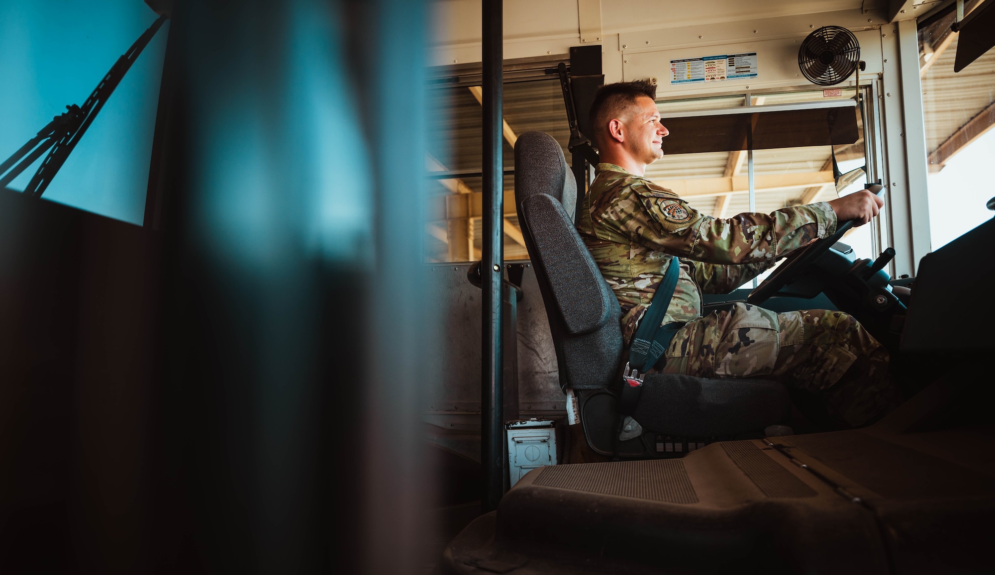 U.S. Air Force Senior Airman Mykhailo Khromiak, 56th Logistics Readiness Squadron ground transportation operator, prepares to drive a bus.