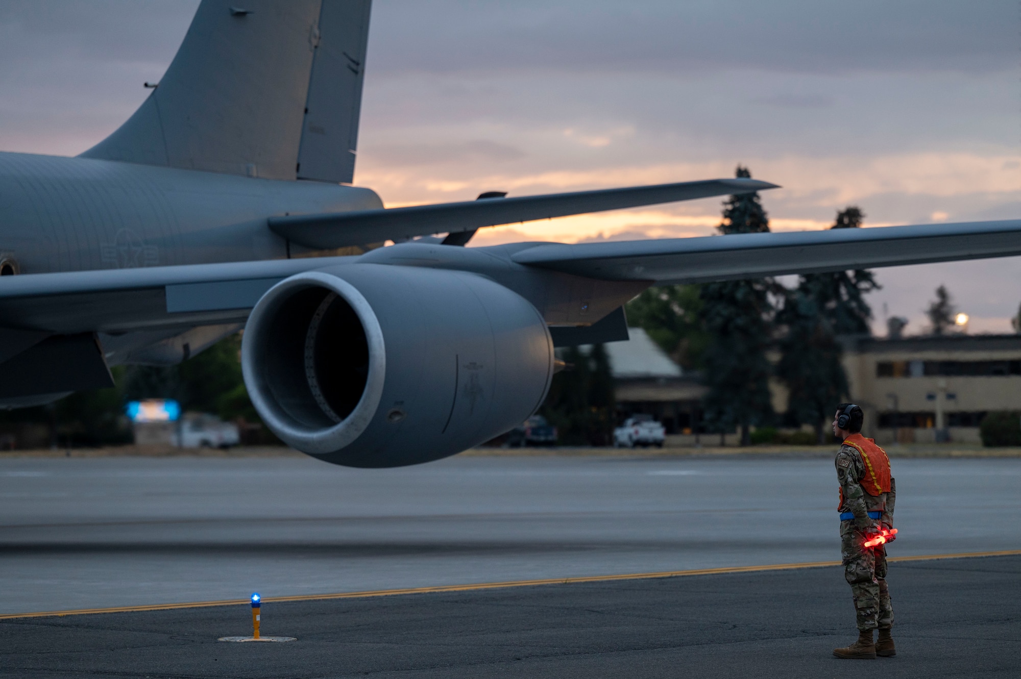 An Airman assigned to the 92nd Aircraft Maintenance Squadron prepares to marshal a KC-135 Stratotanker during exercise Titan Fury 24-7 at Fairchild Air Force Base, Washington, Sept. 11, 2024. During the exercise, aircrews performed a simulated alert response and were graded on their ability to rapidly respond at a moment’s notice. Titan Fury is a recurring total force exercise that ensures Fairchild’s Airmen are trained and ready to provide Rapid Global Mobility at a moment’s notice in support of strategic deterrence and the National Defense Strategy. This exercise is an example of how the 92nd ARW is engaged, postured and ready with a credible force to assure, deter and defend in an increasingly complex security environment. (U.S. Air Force photo by Airman 1st Class Samantha Thorn)