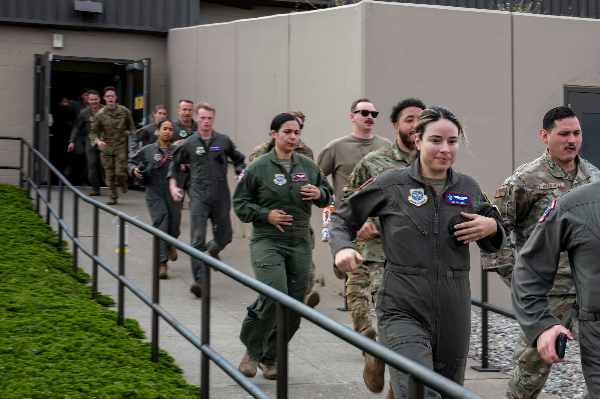 Airmen run in a group.