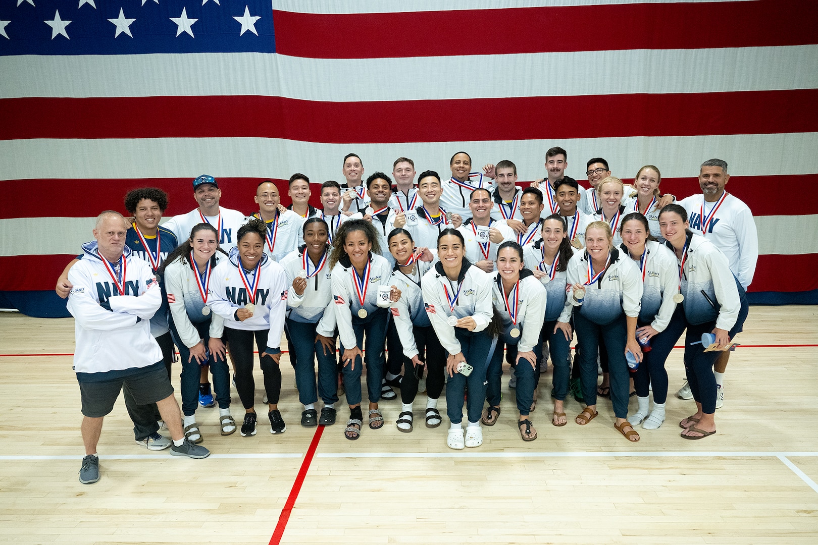 Navy Men and Women celebrate winning silver at the 2024 Armed Forces Men’s and Women’s Volleyball Championship held at Fort Carson, Colorado 10-14 September.  Teams from the Army, Navy (with Marine Corps and Coast Guard players) and Air Force (with Space Force players) battle it out for gold.  (DoD photo by EJ Hersom)