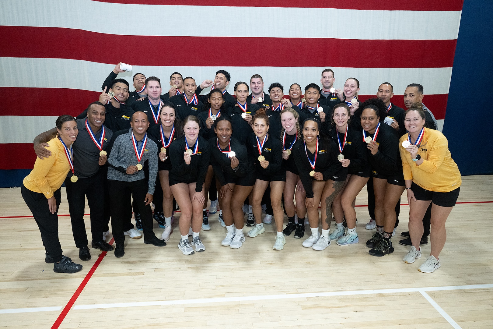 Army Men and Women celebrate winning gold at the 2024 Armed Forces Men’s and Women’s Volleyball Championship held at Fort Carson, Colorado 10-14 September.  Teams from the Army, Navy (with Marine Corps and Coast Guard players) and Air Force (with Space Force players) battle it out for gold.  (DoD photo by EJ Hersom)