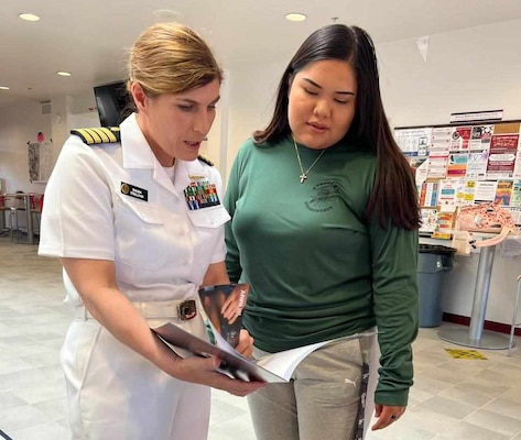 Capt. Shauna O’Sullivan, a rheumatologist and Navy Medical Corps career planner at U.S. Navy Bureau of Medicine and Surgery (BUMED) and a 1998 graduate of the University of New Mexico, speaks with a student at the Navajo Technical University (NTU) during Albuquerque Navy Week, Sept. 13.