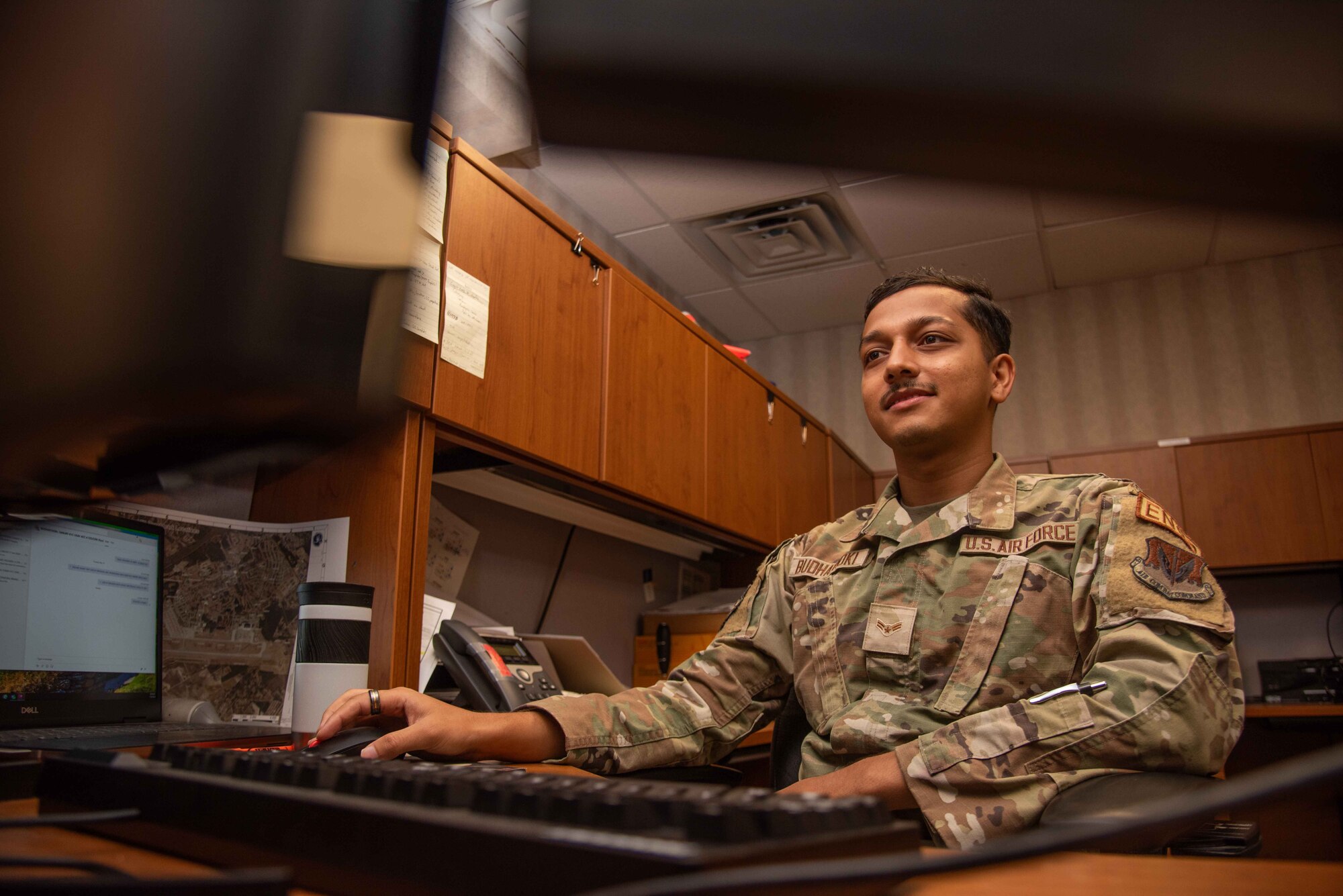 A1C Sanjay Budhathoki, 4th CES engineering journeyman, labels and marks a building floor plan.