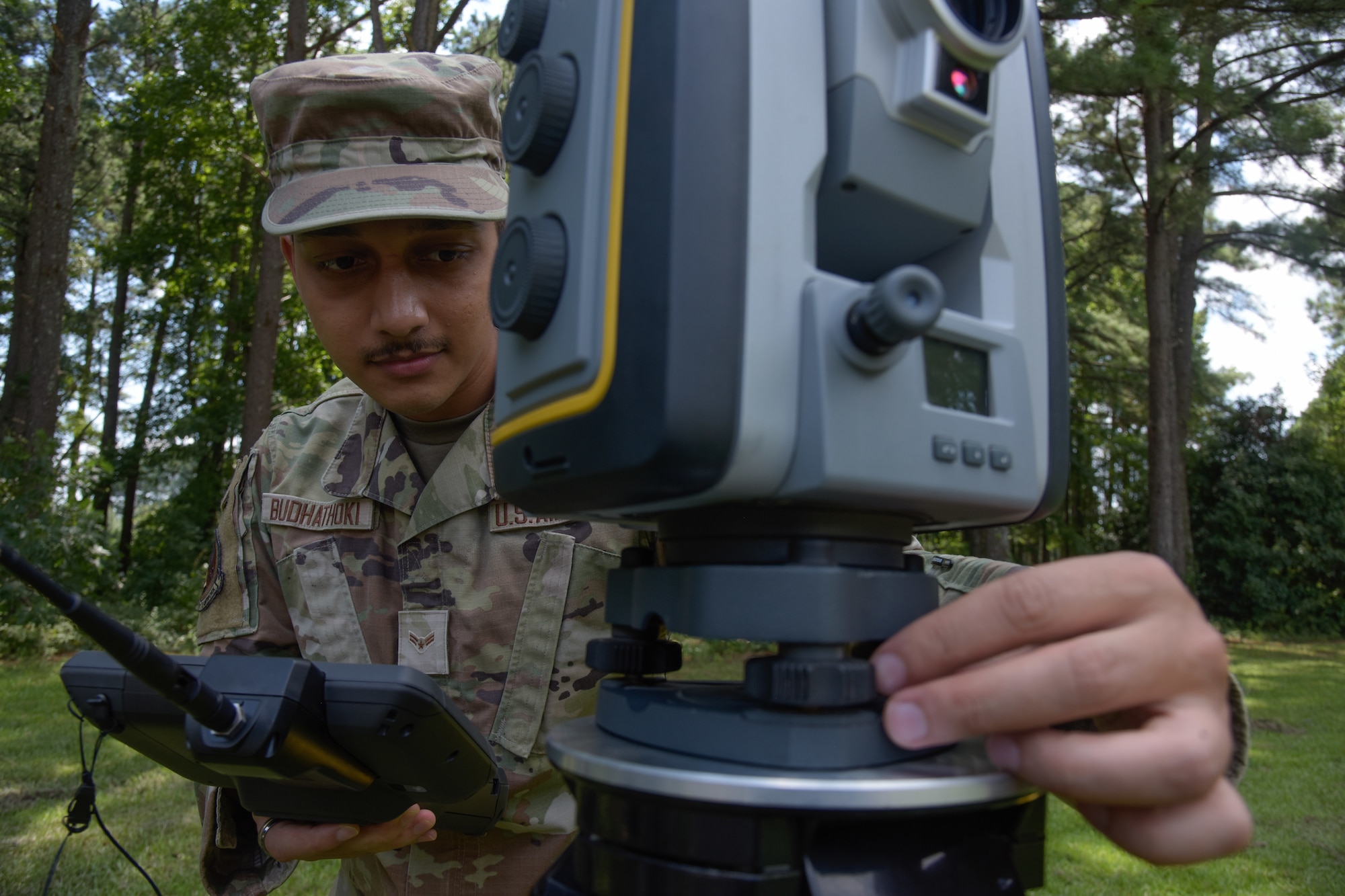 A1C Sanjay Budhathoki, 4th CES engineering journeyman, configures a GPS.