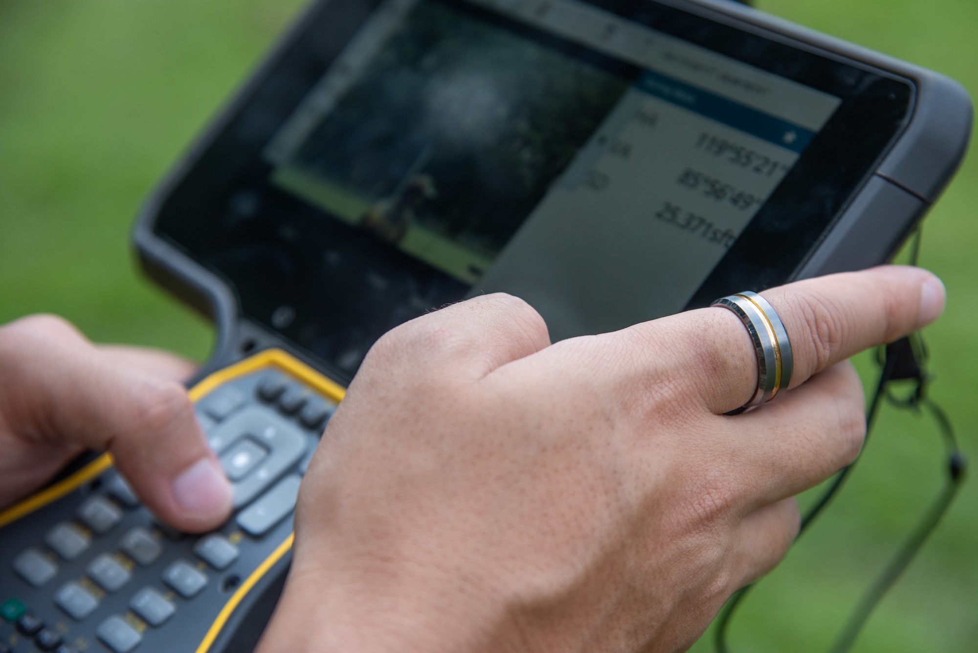 A1C Sanjay Budhathoki, 4th CES engineering journeyman, views data compiled by a GPS.