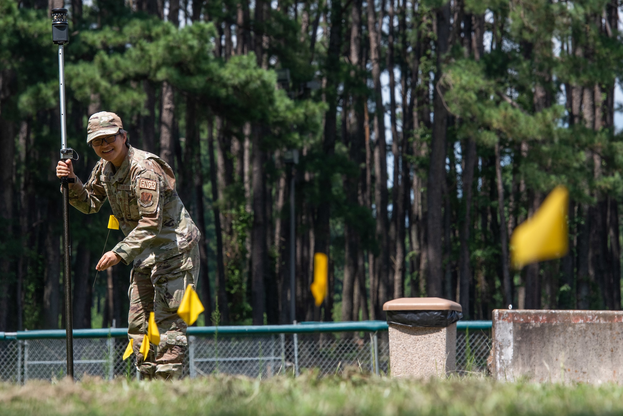 A1C Yuxin Chen, 4th CES engineering journeyman, lays down flags to mark points designated by a GPS.