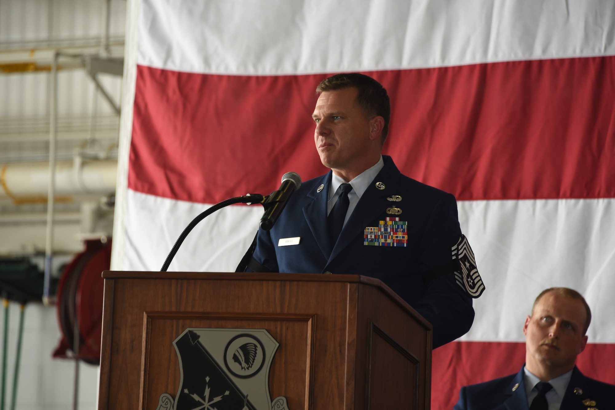 185th Air Refueling Wing Command Chief Master Sgt. Justin Odell speaks to 185th ARW unit members during a change of responsibility ceremony.