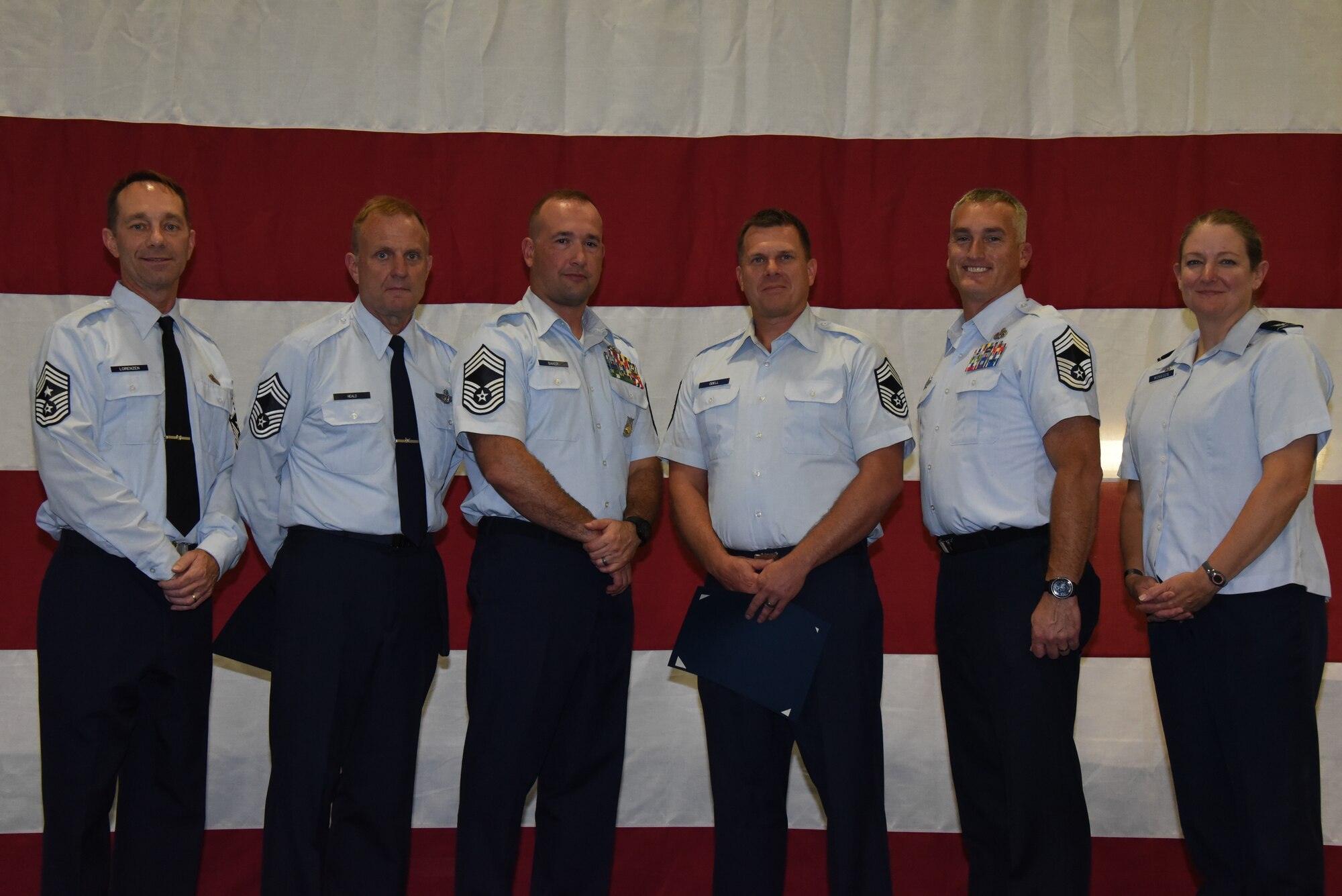 Chief master sergeants stand in a line