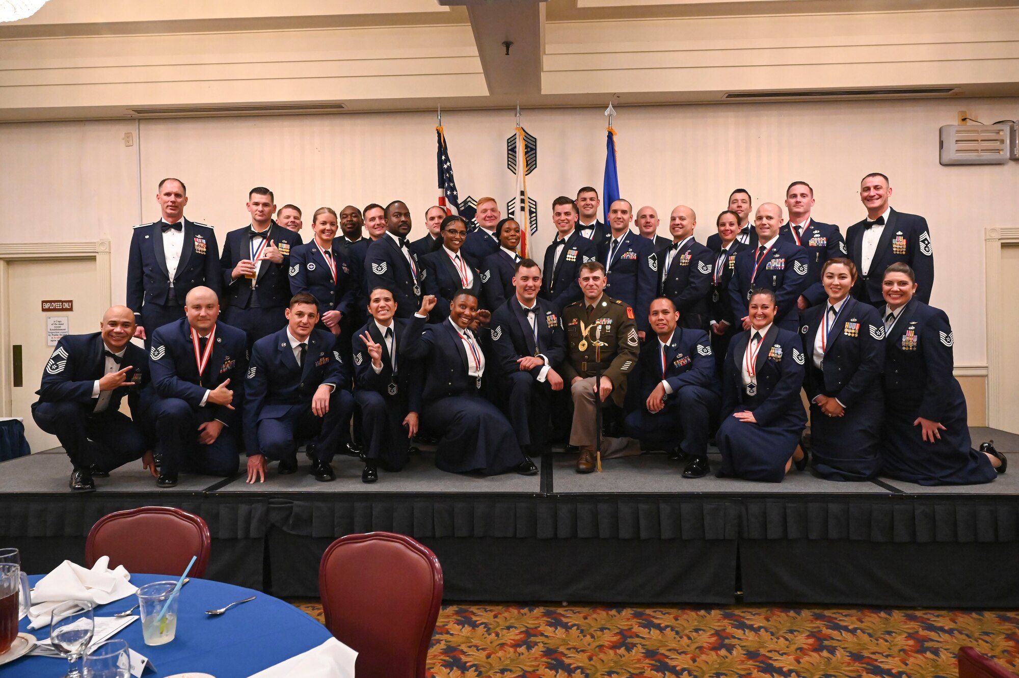 U.S. Air Force senior noncommissioned officer inductees pose for a group photo during an SNCO induction ceremony.