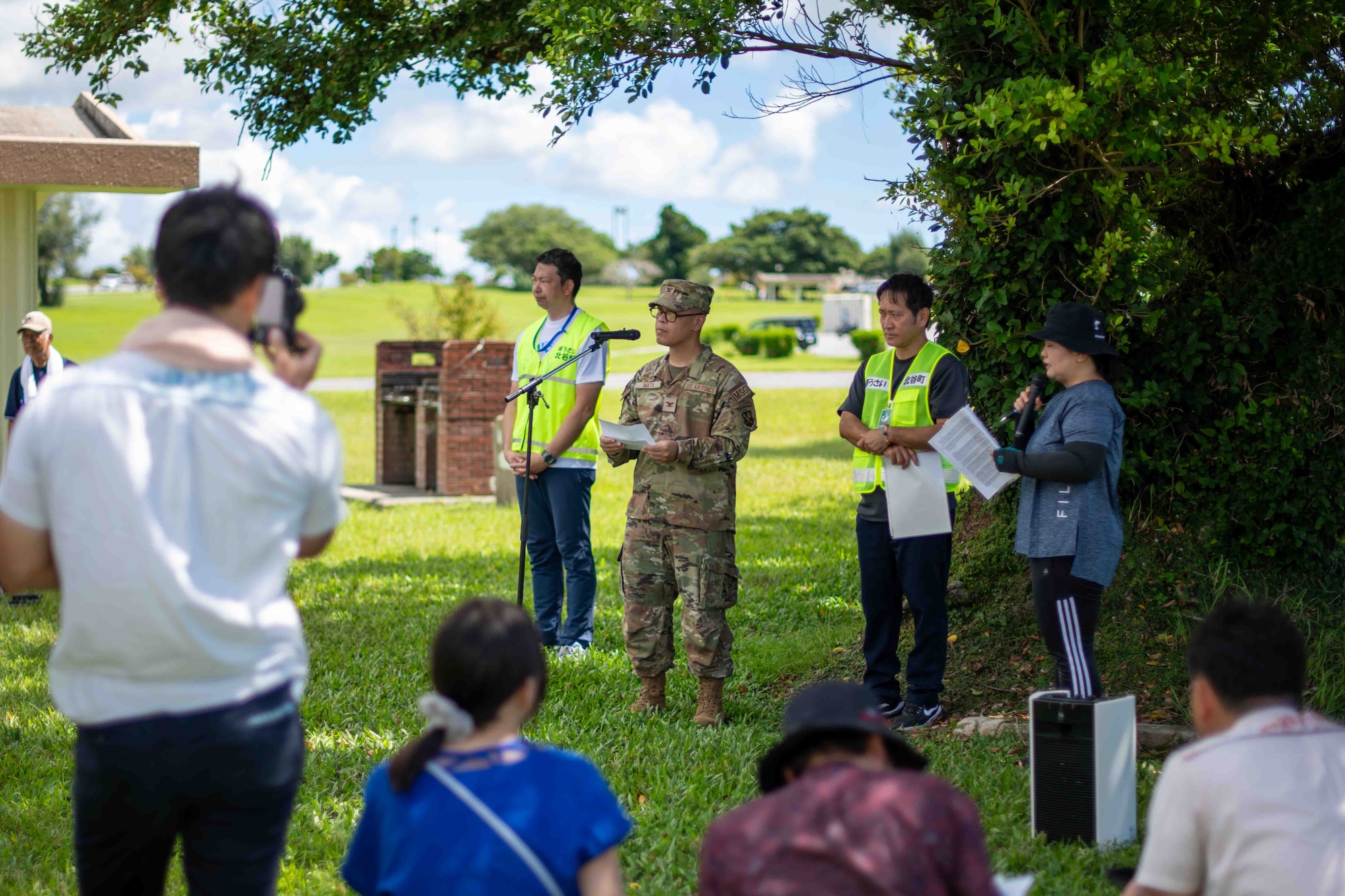 military member gives a speech in front of a crowd.