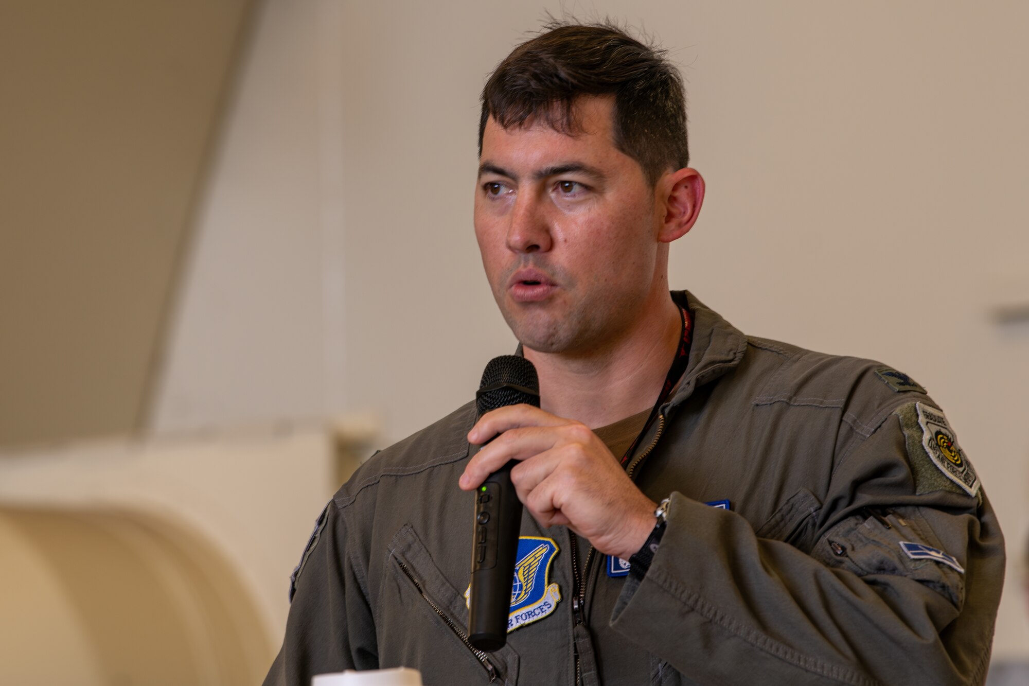The commander of the 18th Operations Group speaking during a change of command