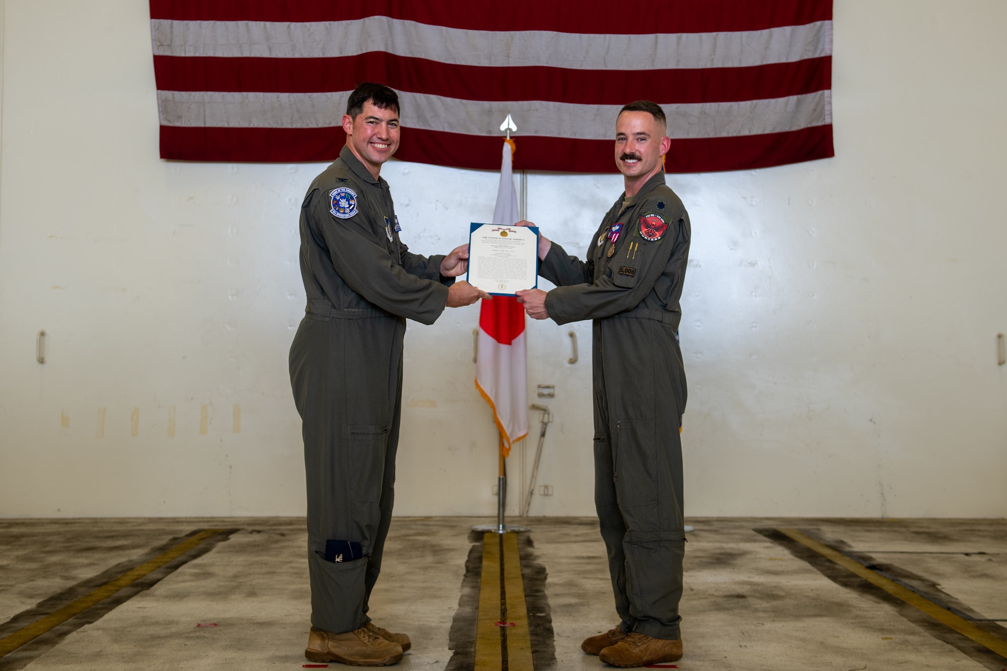 The outgoing commander of the 319th receiving the Meritorious Service Medal