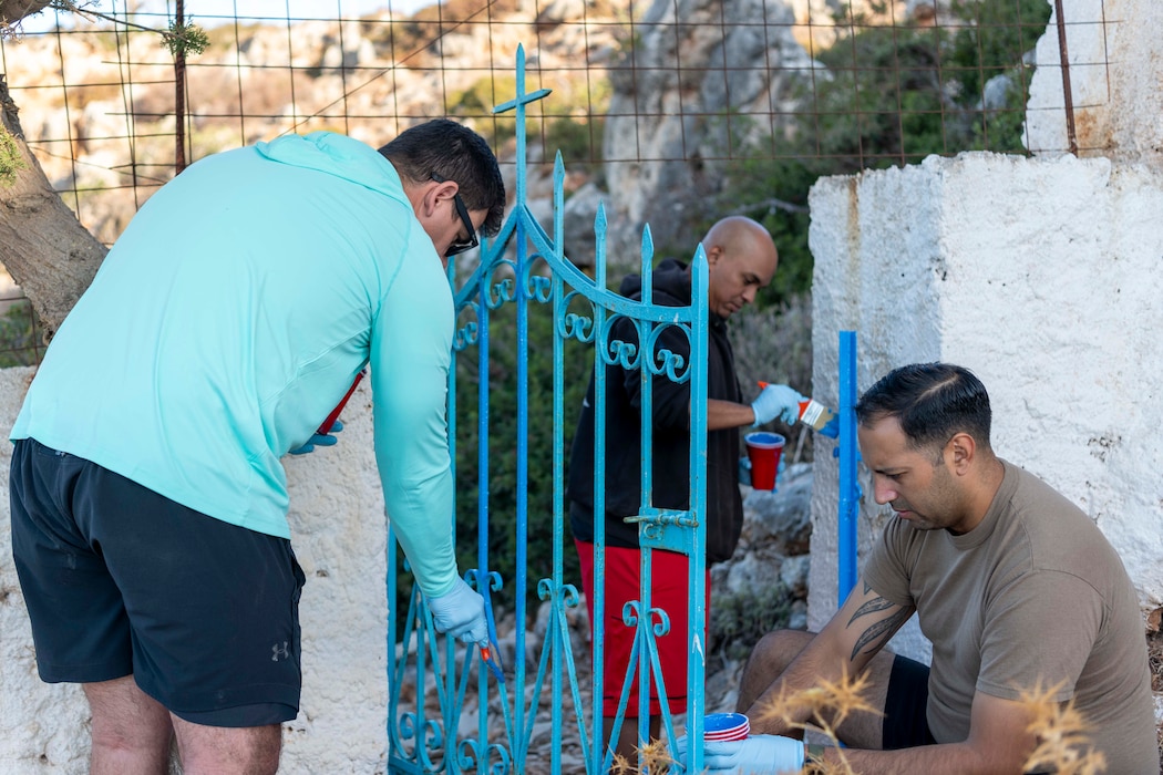 Sailors assigned to Naval Support Activity (NSA) Souda Bay paint a church in Mouzouras, Greece, on Aug. 24, 2024.