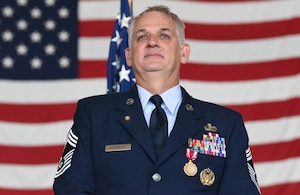 New York Air National Guard Chief Master Sgt. Jason Kruenegel, stands during his retirement ceremony at Francis .S. Gabreski Air National Guard Base in Westhampton Beach, New York, Sept. 6, 2024.