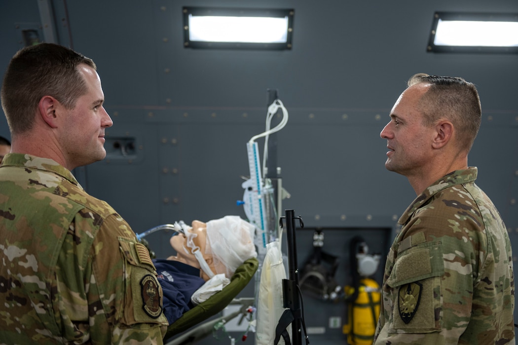 Army Lt. Gen. speaks with medical Airman on a KC-46A Pegasus